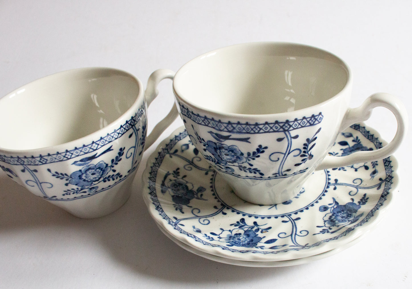 Johnson Brothers 'Indies' Blue and White Transferware Teacups and Sacuers (2)