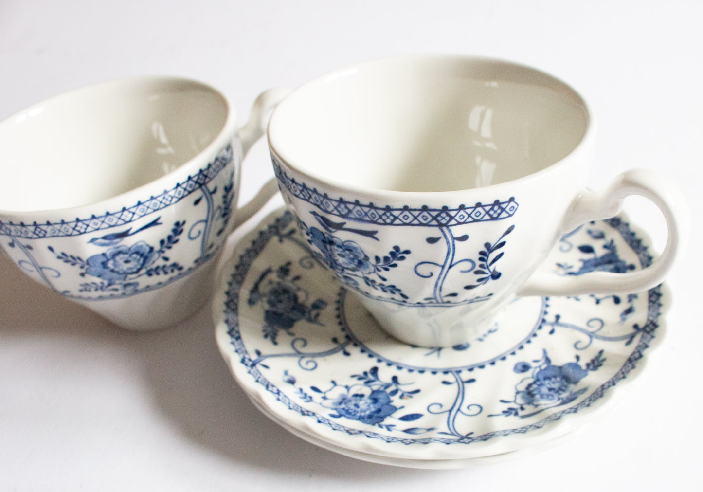 Johnson Brothers 'Indies' Blue and White Transferware Teacups and Sacuers (2)