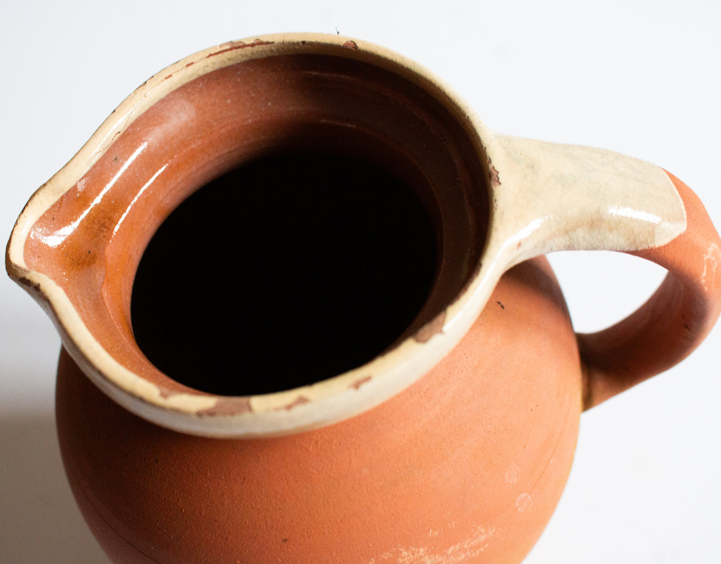 Antique West Country Terracotta Jug or Pitcher with Cream Lip and Glazed Interior