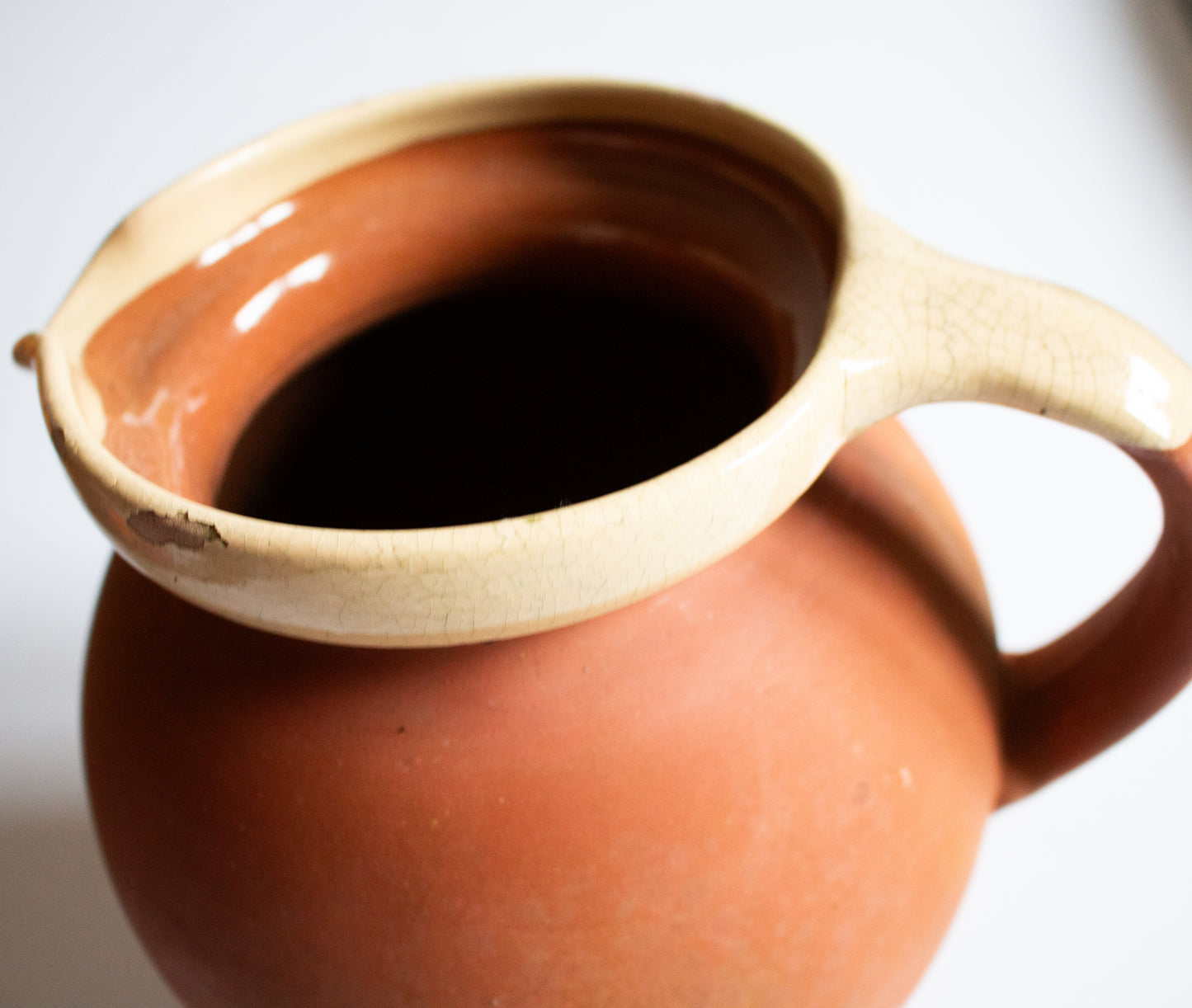 Large Antique West Country Terracotta Jug or Pitcher with Cream Lip and Glazed Interior