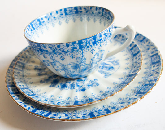 Vintage Blue and White China Teacup Trio with Floral and Gilt Detail