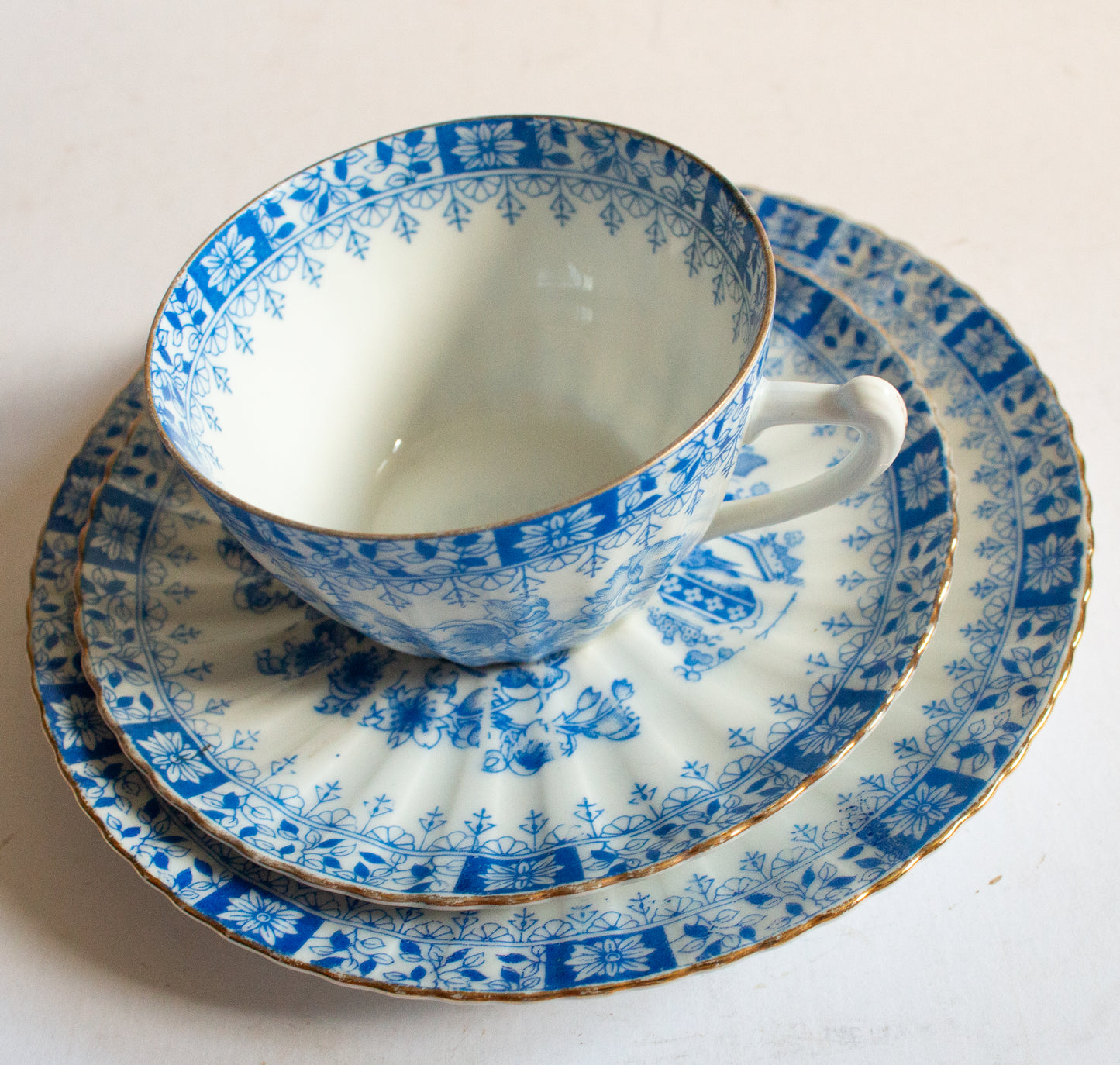 Vintage Blue and White China Teacup Trio with Floral and Gilt Detail