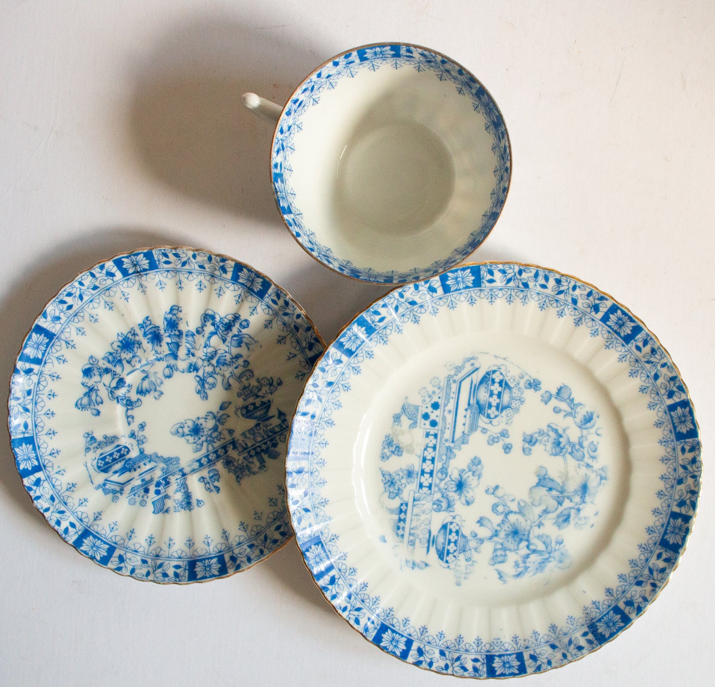 Vintage Blue and White China Teacup Trio with Floral and Gilt Detail