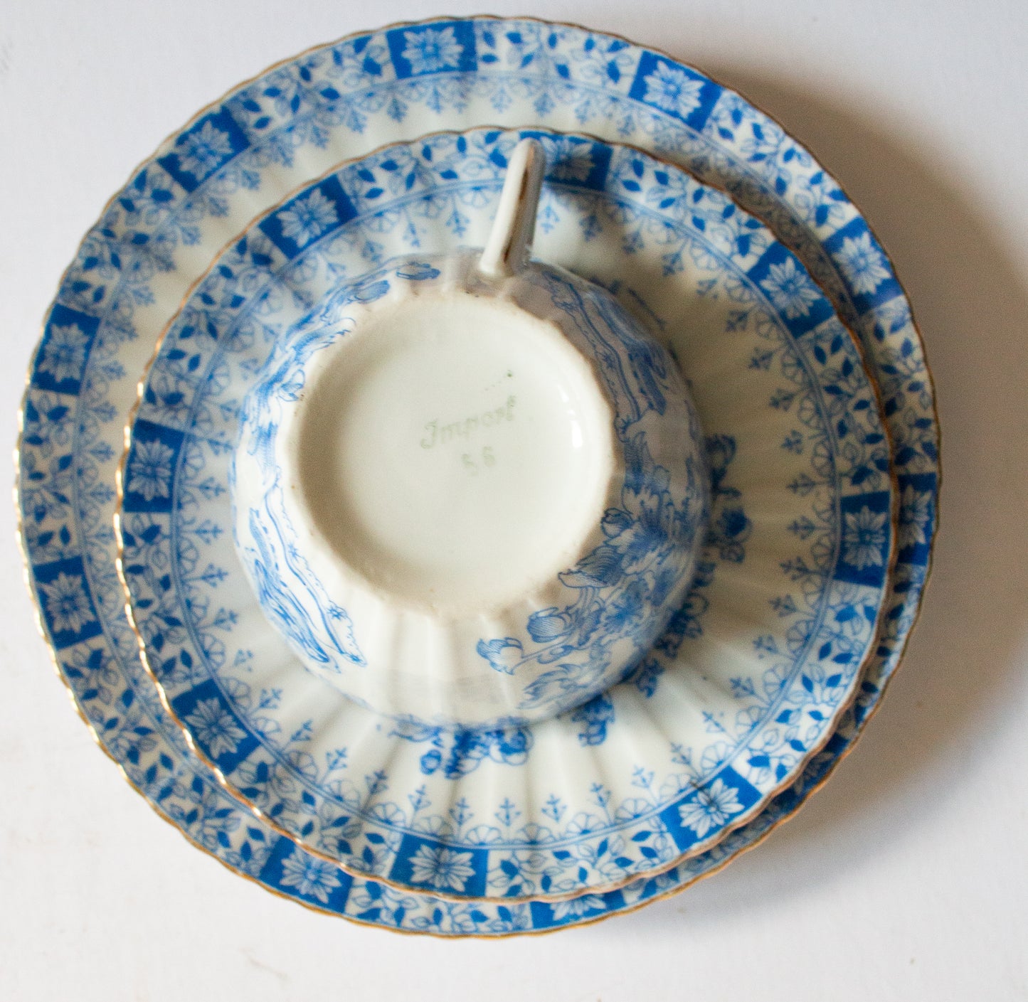 Vintage Blue and White China Teacup Trio with Floral and Gilt Detail