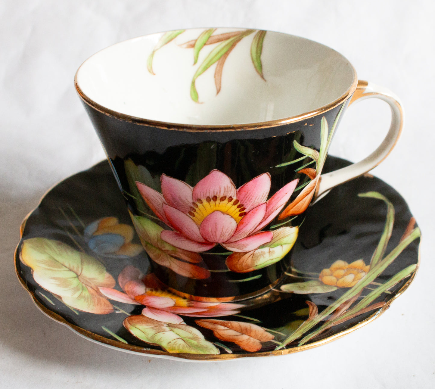 Aynsley Bone China Black and Gold Coffee Cup and Saucer with Handpainted Water Lily Detail