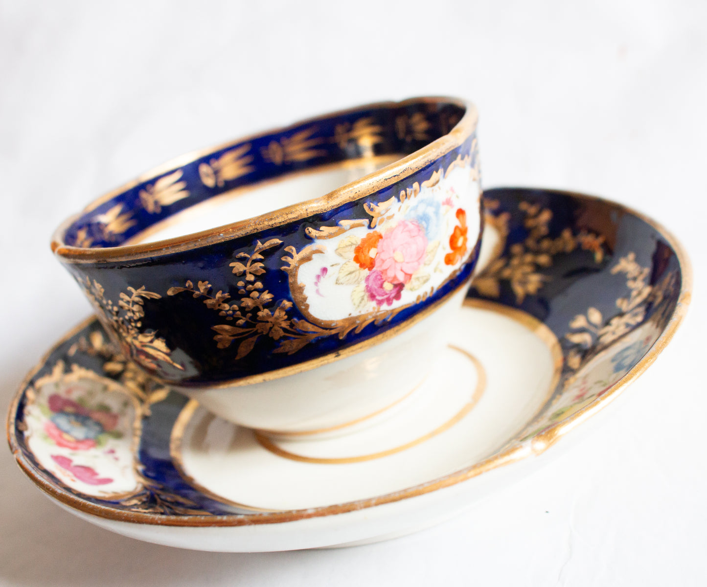 Antique Cobalt and Gold Bone China Teacup and Saucer with Hand painted Floral Detail