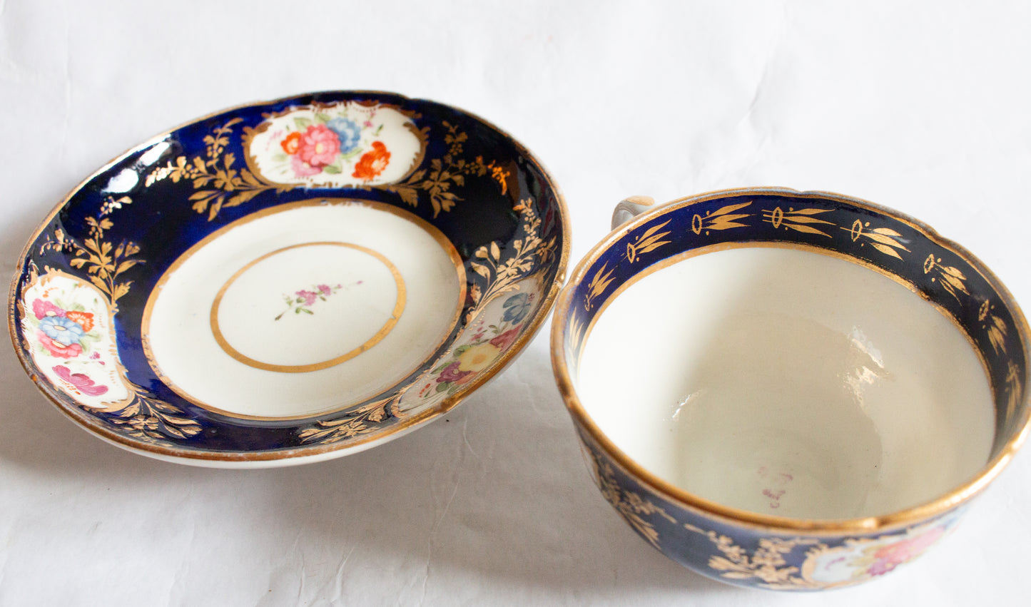 Antique Cobalt and Gold Bone China Teacup and Saucer with Hand painted Floral Detail