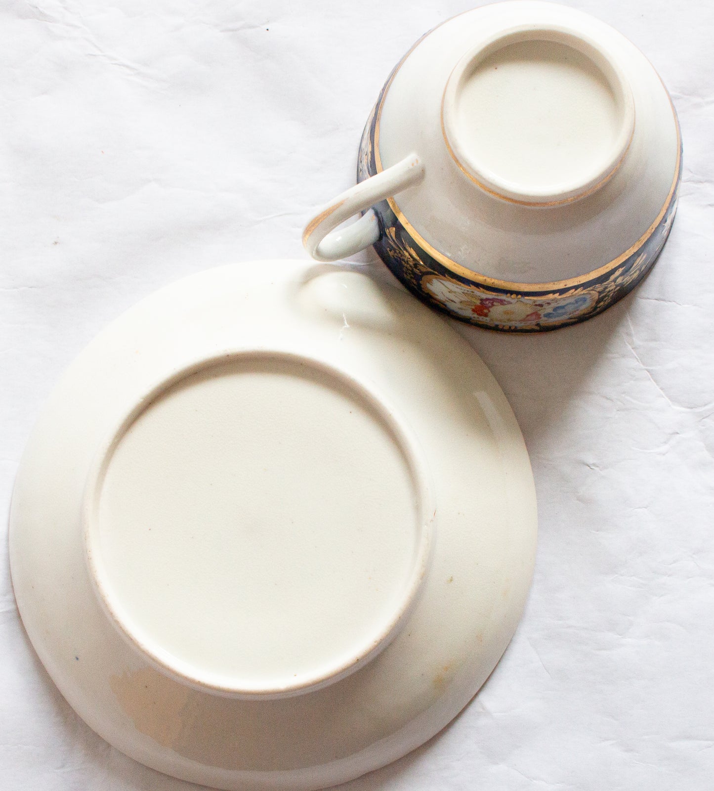 Antique Cobalt and Gold Bone China Teacup and Saucer with Hand painted Floral Detail