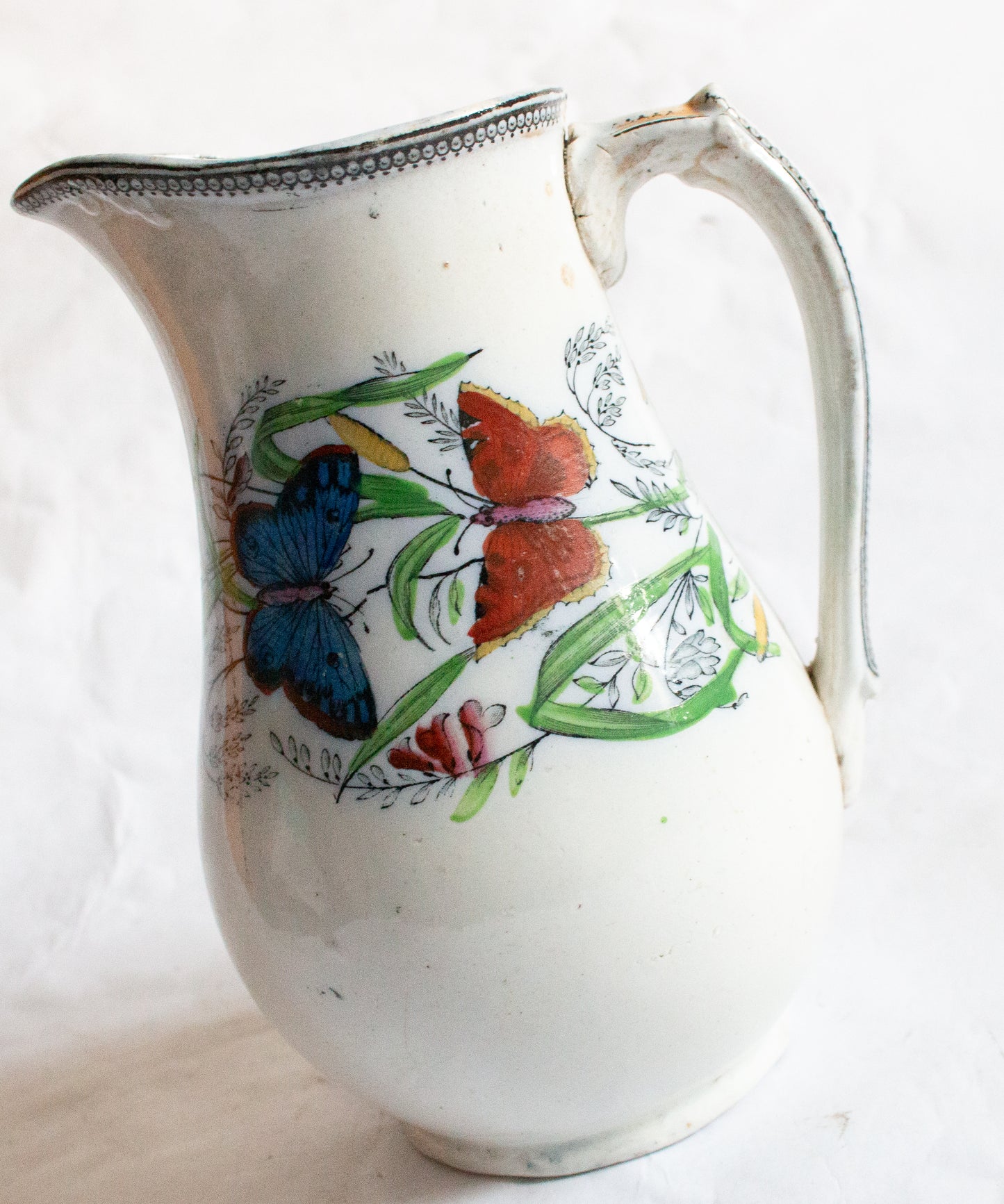 Antique Jug with Butterflies Detail