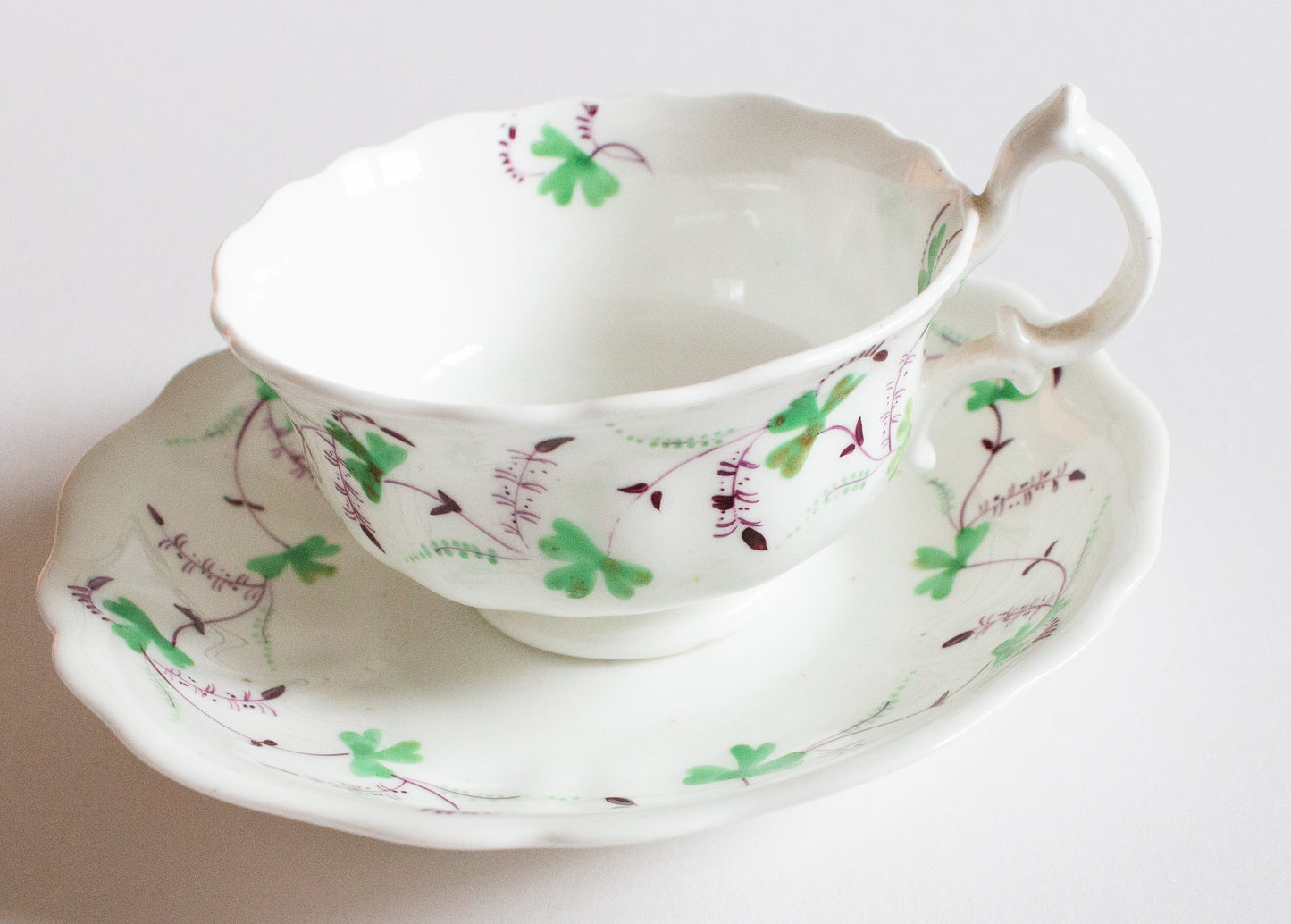 Antique Purple and Green Floral Motif Teacup and Saucer