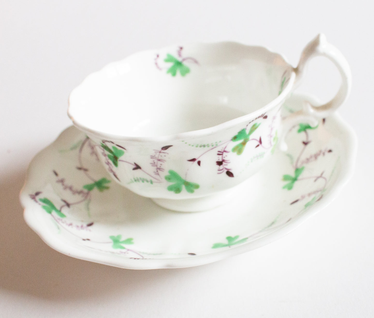 Antique Purple and Green Floral Motif Teacup and Saucer