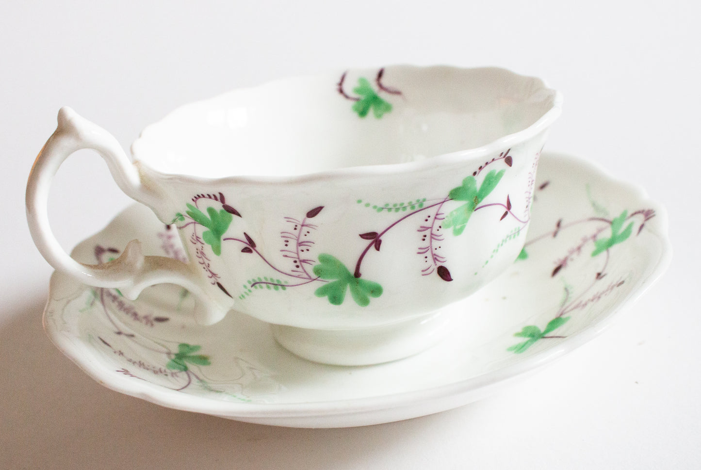 Antique Purple and Green Floral Motif Teacup and Saucer