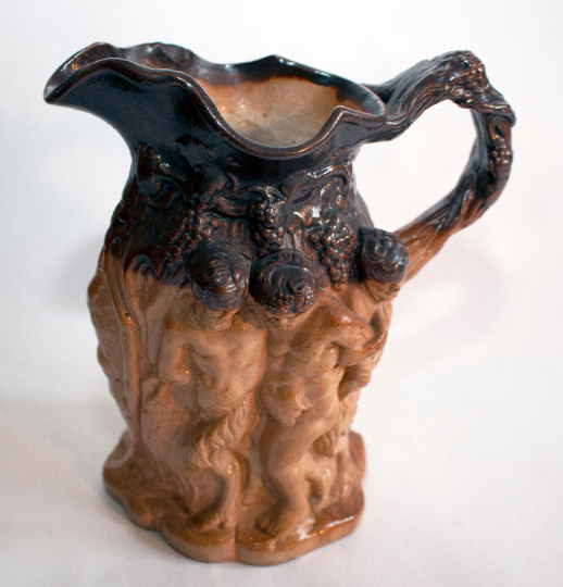 Antique Stoneware Brown Treacle Glazed Jug with Bacchanalian Figures