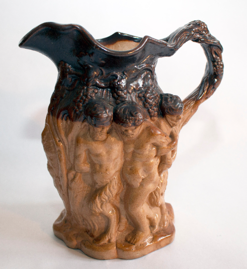 Antique Stoneware Brown Treacle Glazed Jug with Bacchanalian Figures